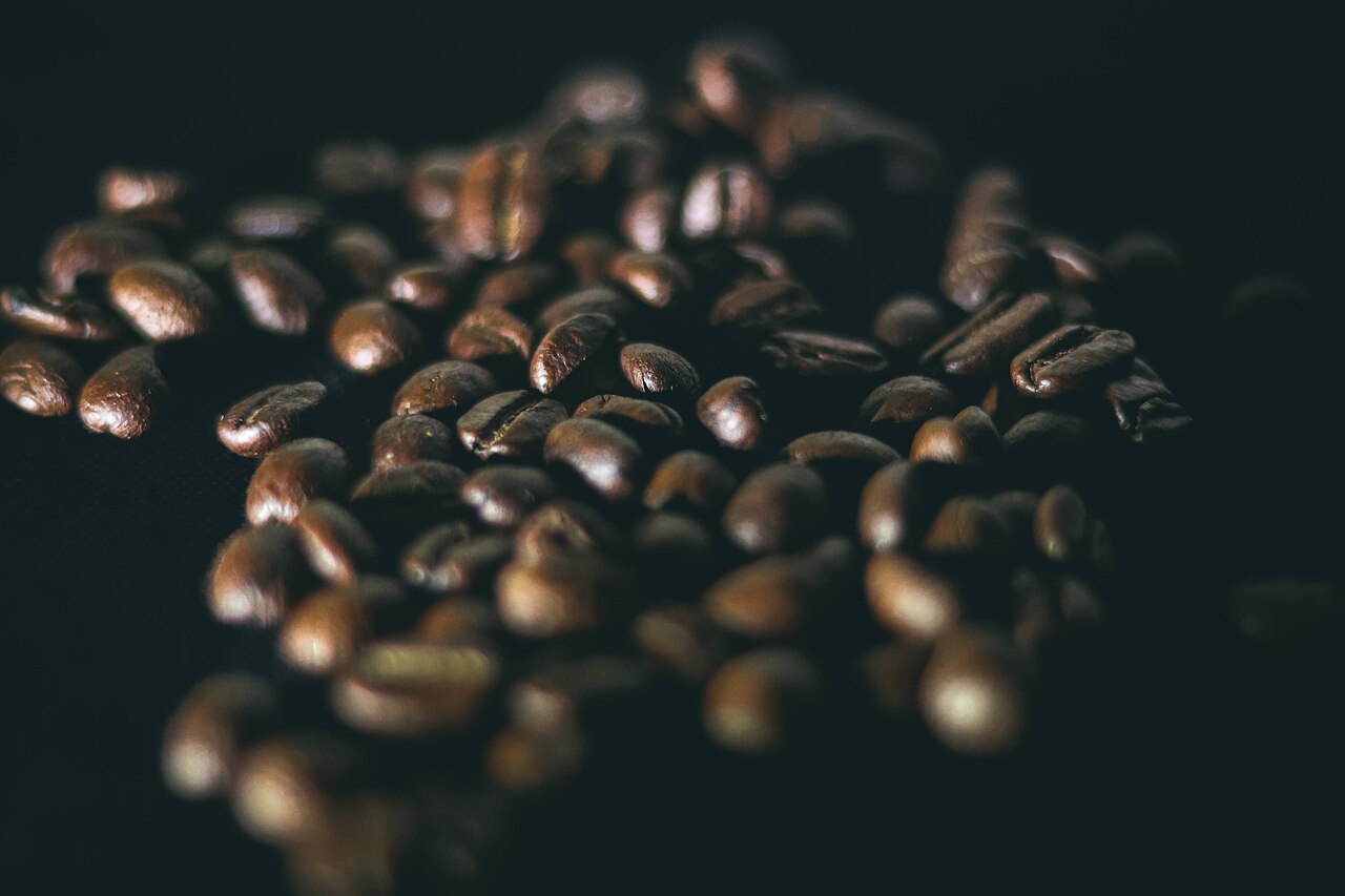 Roasted coffee beans on a dark background